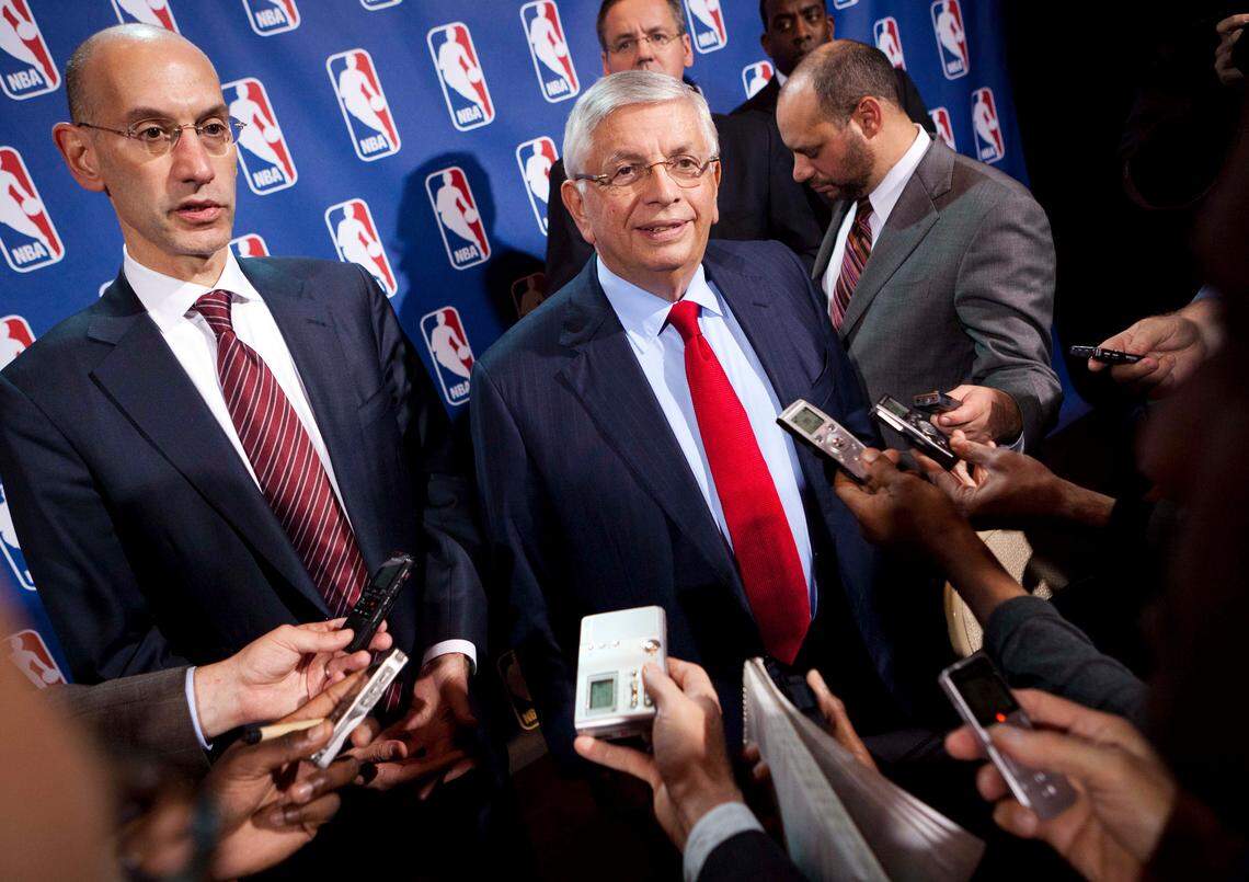 FILE - In this Nov. 10, 2011, file photo, NBA Commissioner David Stern, center, speaks to the news media alongside Deputy commissioner Adam Silver after a marathon meeting with the Players Association in New York. Former NBA Commissioner David Stern believes medicinal marijuana use should be allowed, but the league says it won’t allow players to use it for recreational use. Adam Silver, who replaced Stern as commissioner in 2014, has said he is interested in studying more about the safety of medicinal marijuana. (AP Photo/John Minchillo, File)