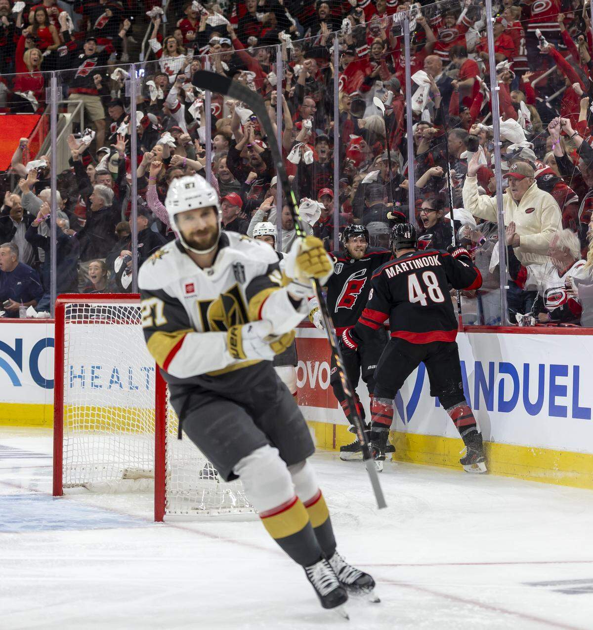 Carolina Hurricanes left wing Nikolaj Ehlers (27) celebrates with teammate Jordan Martinook (48) after scoring to take a 1-0 lead against Las Vegas in Game 1 of the Stanley Cup Finals, on Tuesday, June 2, 2026 at Lenovo Center in Raleigh, N.C. 