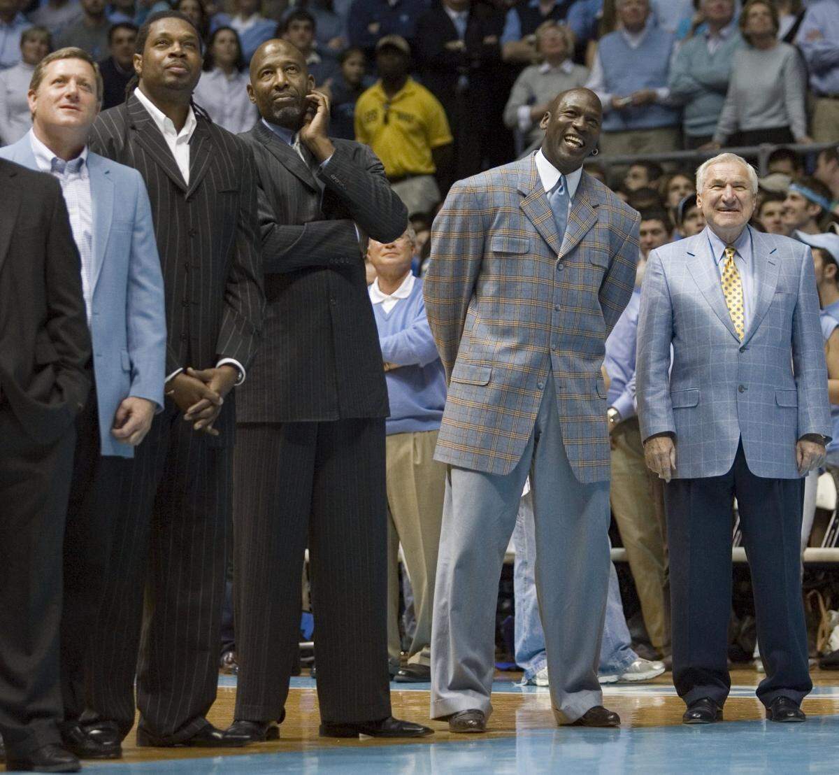 UNC17.SP.021007.RTW--Chapel Hill, N.C.--UNC coach Dean Smith stands next to Michael Jordan and members of the 1982 National Championship team during half-time of the UNC vs. Wake Forest on Saturday February 10, 2007 in the Smith Center. Staff photo by Robert Willett/The News & Observer