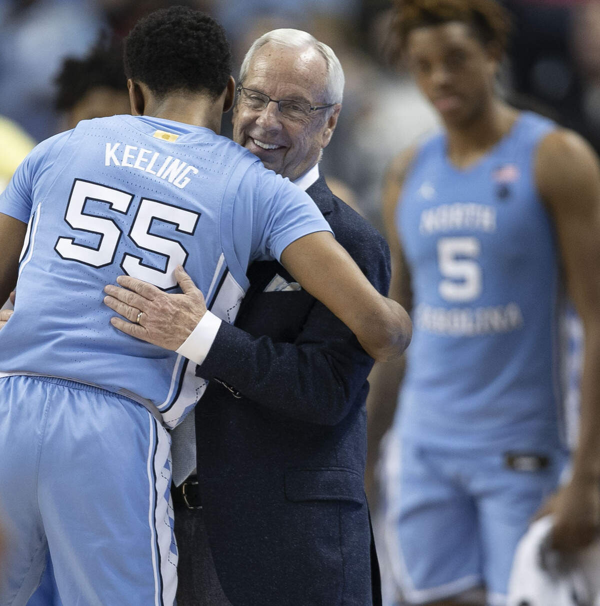North Carolina’s Christian Keeling (55) embraces coach Roy Williams as he come out of the game in the second half on Tuesday, March 10, 2020 during the first round of the ACC Tournament at the Greensboro Coliseum in Greensboro, N.C.