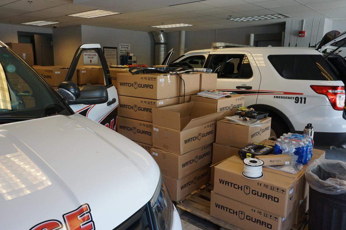 Mobile Communications America employees installing WatchGuard dash cameras into police cars in Cary photographed by Trent Brown on July 25, 2019. These installations will be continuing through September 2019.