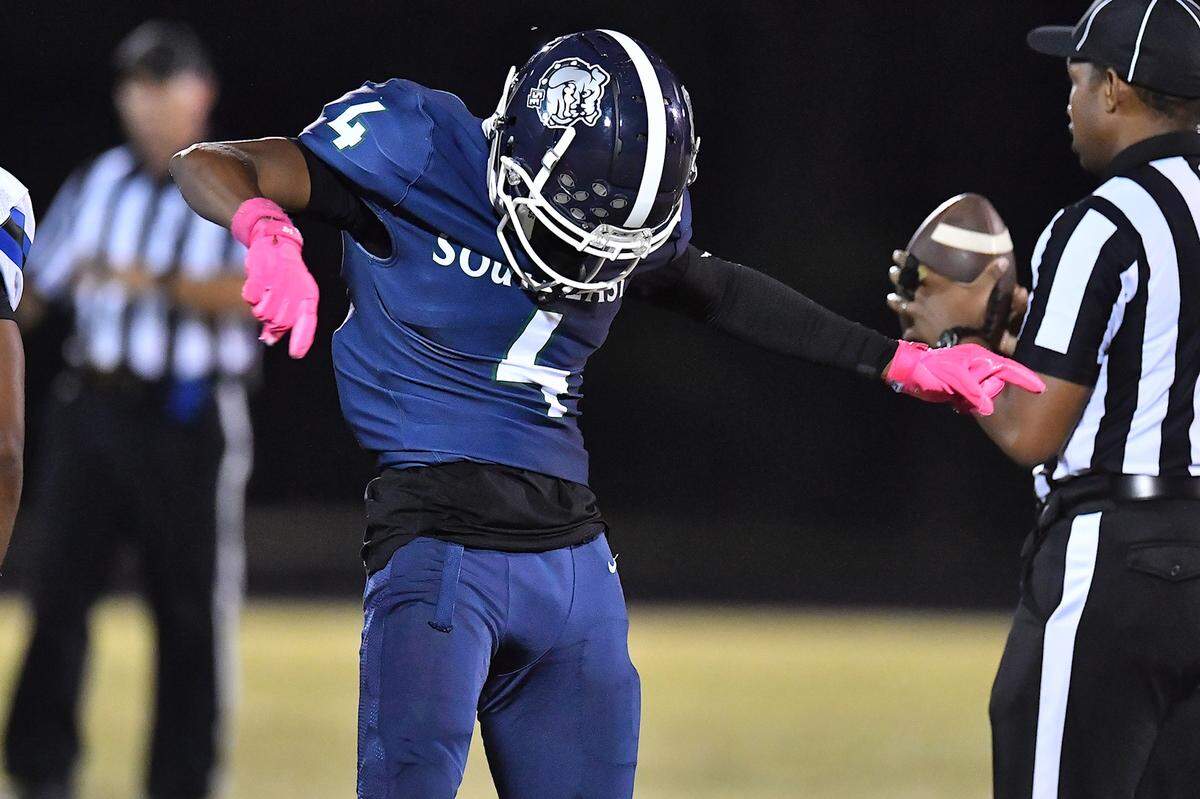 Southeast Raleigh wide receiver Adam Saunders (4) reacts after making the catch and running for the first down against Clayton during the second half. The Southeast Raleigh Bulldogs and the Clayton Comets met in a non-conference football game in Raleigh, N.C. October 3, 2025