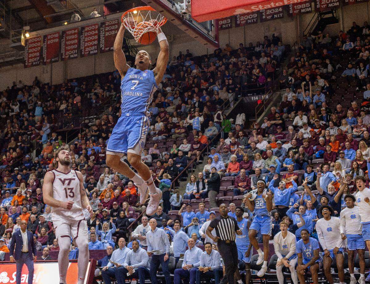North Carolina guard Seth Trimble (7) soars to the basket for a dunk on a fast break in the second half against Virginia Tech on Tuesday, March 3, 2025 at Cassell Coliseum in Blacksburg, Va. Trimble scored 17 points in the Tar Heels’ 91-59 victory.