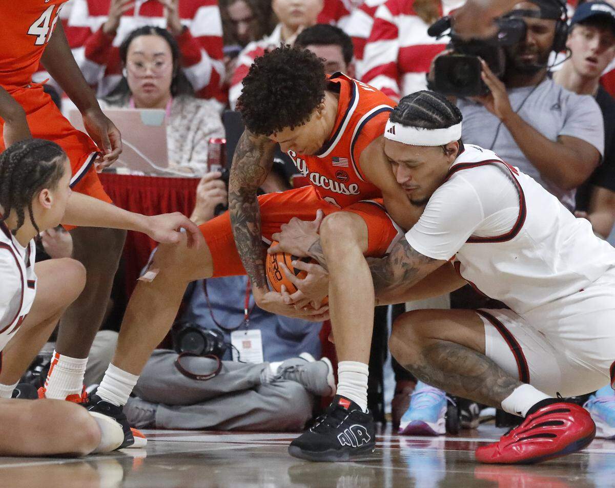 N.C. State’s Darrion Williams pressures Syracuse’s Nate Kingz during the second half of the Wolfpack’s 88-68 win on Tuesday, Jan. 27, 2026, at Lenovo Center in Raleigh, N.C. 