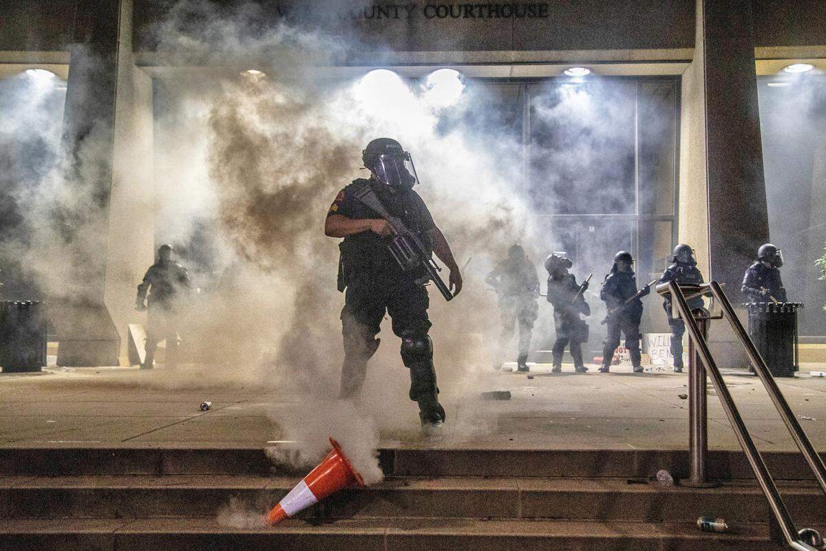 A series of photos from the protests in downtown Raleigh Saturday, May 30, 2020, took first place in photo page category among the state’s largest newspapers in the North Carolina Press Association’s annual awards.