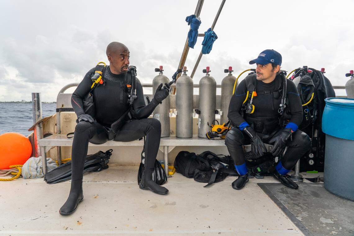 JB Smoove, left, and Brad Paisley, right, in the Shark Week 2021 special “Brad Paisley’s Shark Country.”