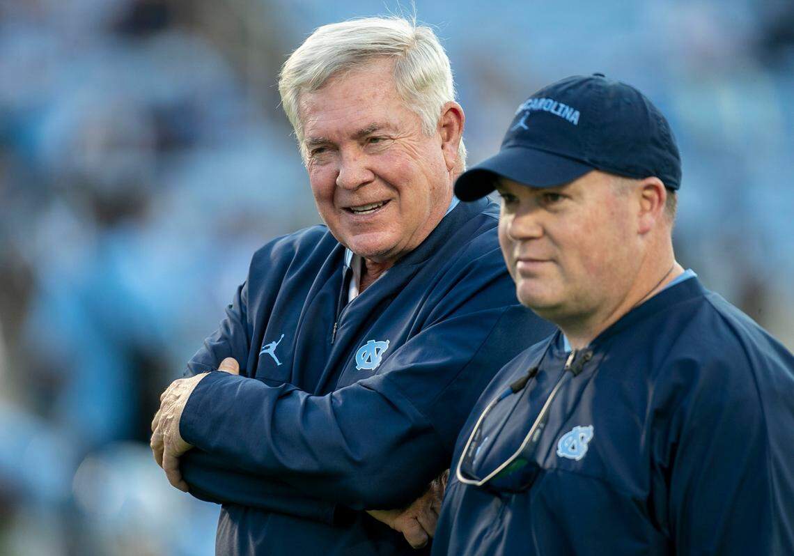 North Carolina coach Mack Brown talks with defensive coordinator Jay Bateman prior to the Tar Heels’ game against Georgia State on Saturday, September 11, 2021 at Kenan Stadium in. Chapel Hill, N.C.