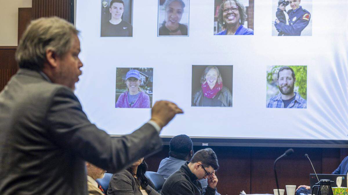 Photographs of the victims of the 2022 Hedingham neighborhood mass shooting are displayed on a screen as Wake County Assistant District Attorney Patrick Latour, left, gives the state’s closing arguments during the sentencing hearing for Austin Thompson, center, Thursday, Feb. 12, 2026. Thompson pleaded guilty in the Raleigh mass shooting that killed five people when he was 15. The victims pictured include, from top left, James Thompson, Nicole Connors, Lynn Gardner, Gabriel Jesús Torres, Susan Karnatz, Mary Marshall and Casey Clark.