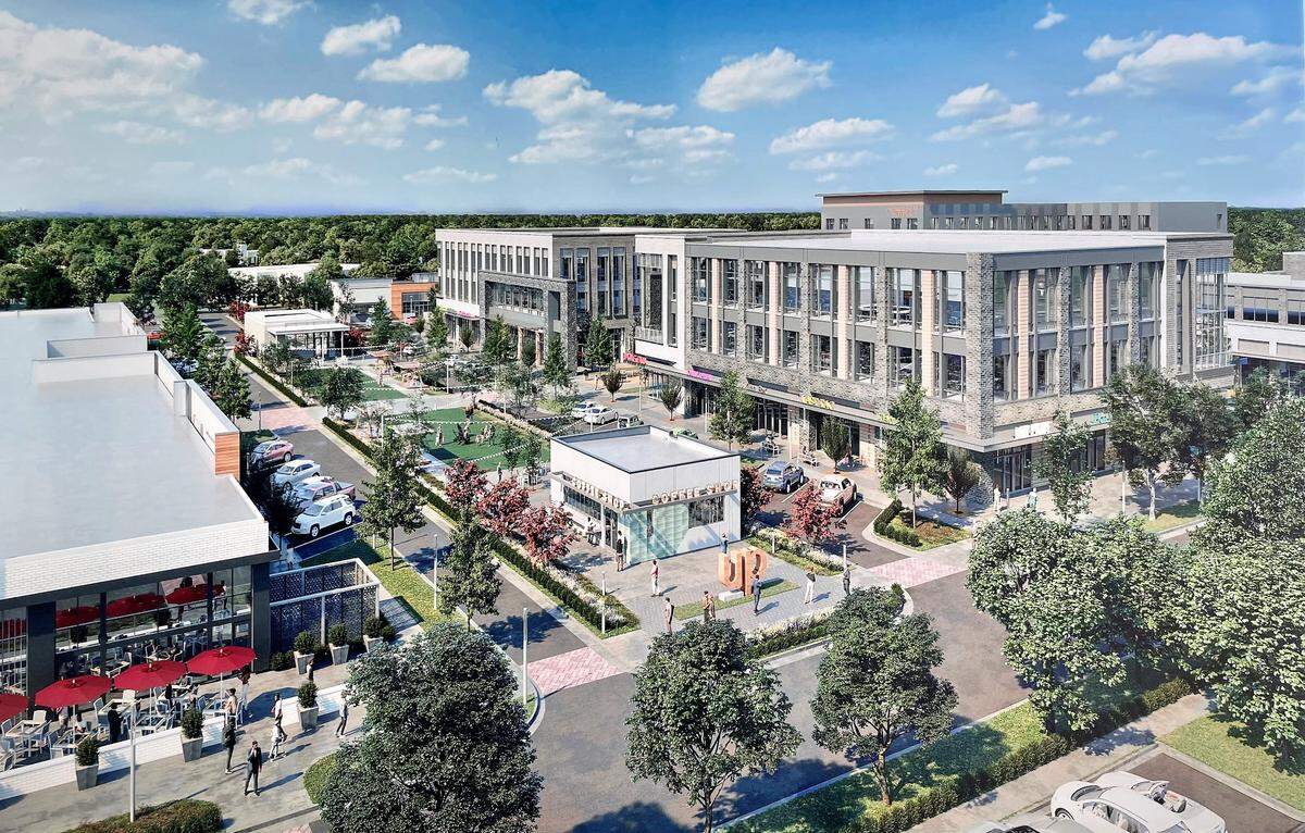 A bird’s eye view of University Place mall shows several new buildings and a large public park that will replace the vacant A Southern Season store and its parking lot on the eastern end of the site.