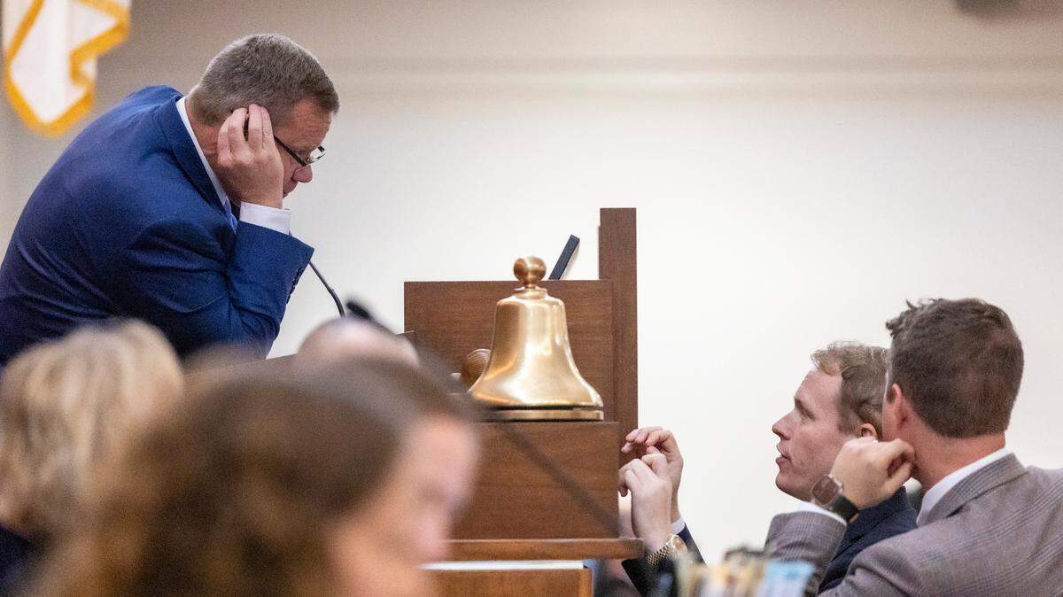 Speaker Tim Moore confers with Rep. Destin Hall, a Caldwell and Watauga County Republican, during veto override votes in the House at the General Assembly in Raleigh on Wednesday, Aug 16, 2023.