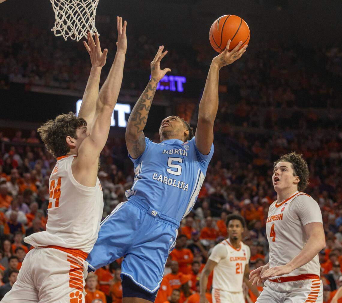 North Carolina’s Armando Bacot (5) puts up a shot against Clemson’s P.J. Hall (24) during the first half on Saturday, January 6, 2024 at Littlejohn Coliseum in Clemson, S.C.