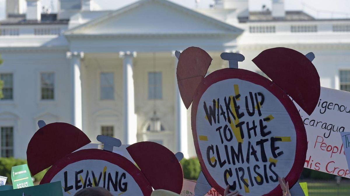 Protesters calling for action on climate change outside the White House in 2017. (AP photo)