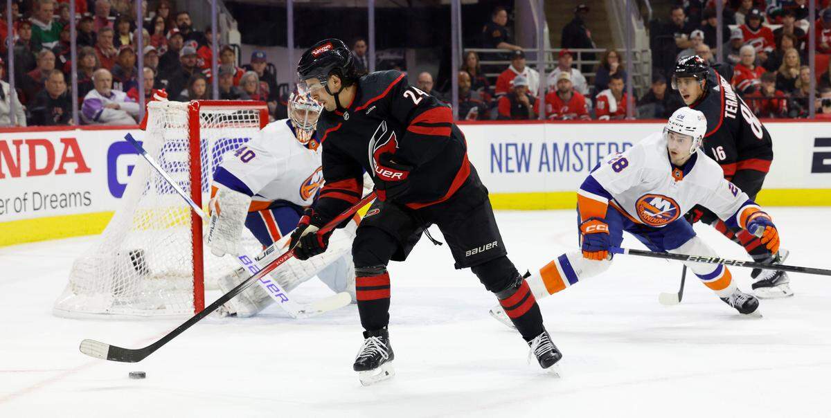 Carolina center Seth Jarvis (24) can’t get the pass to Teuvo Teravainen (86) during the first period of the Hurricanes game against the Islanders in the first round of the Stanley Cup playoffs at PNC Arena in Raleigh, N.C., Monday, April 22, 2024.