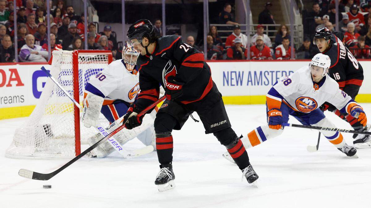 Carolina center Seth Jarvis (24) can’t get the pass to Teuvo Teravainen (86) during the first period of the Hurricanes game against the Islanders in the first round of the Stanley Cup playoffs at PNC Arena in Raleigh, N.C., Monday, April 22, 2024.