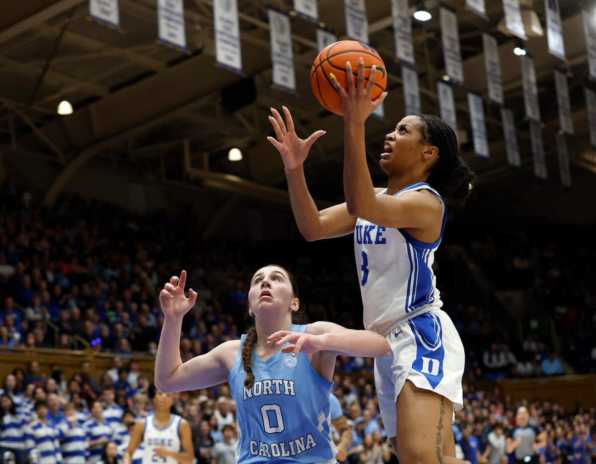 Duke’s Ashlon Jackson drives to the basket past North Carolina’s Lanie Grant during the second half of the Blue Devils’ 68-63 win on Thursday, Feb. 27, 2025, at Cameron Indoor Stadium in Durham, N.C.