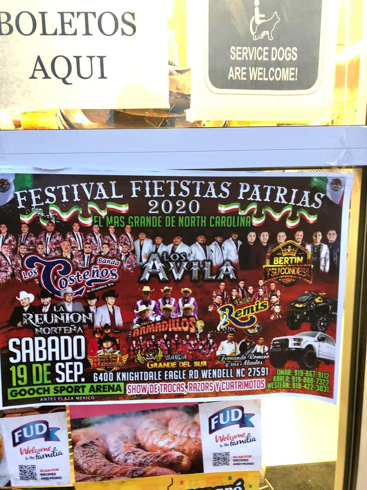 A flyer for the Mexican Independence Day concert held at Gooch Sports Arena in Wendell, NC on Sep. 19, 2020 posted outside La Bonita grocery store in Cary, NC with a “tickets here” sign posted above it.