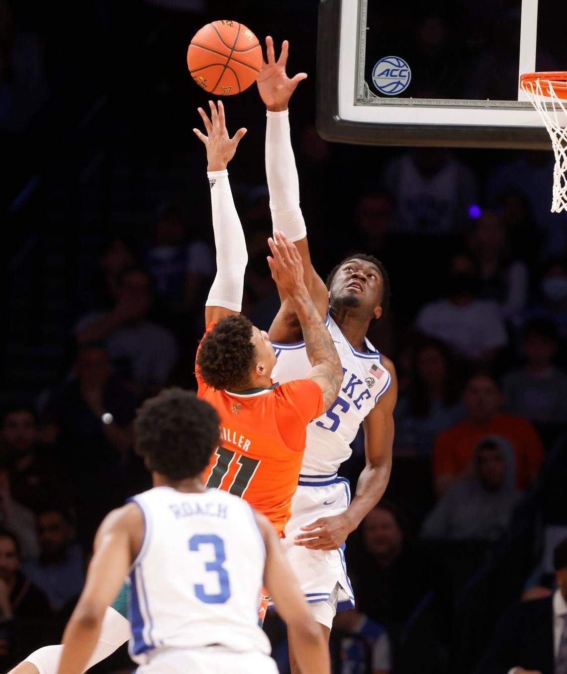Dukes Mark Williams (15) blocks the shot by Miamis Jordan Miller (11) during the second half of Dukes 80-76 victory over Miami in the semifinals of the ACC mens basketball tournament at the Barclays Center in Brooklyn, N.Y., Friday, March 11, 2022.