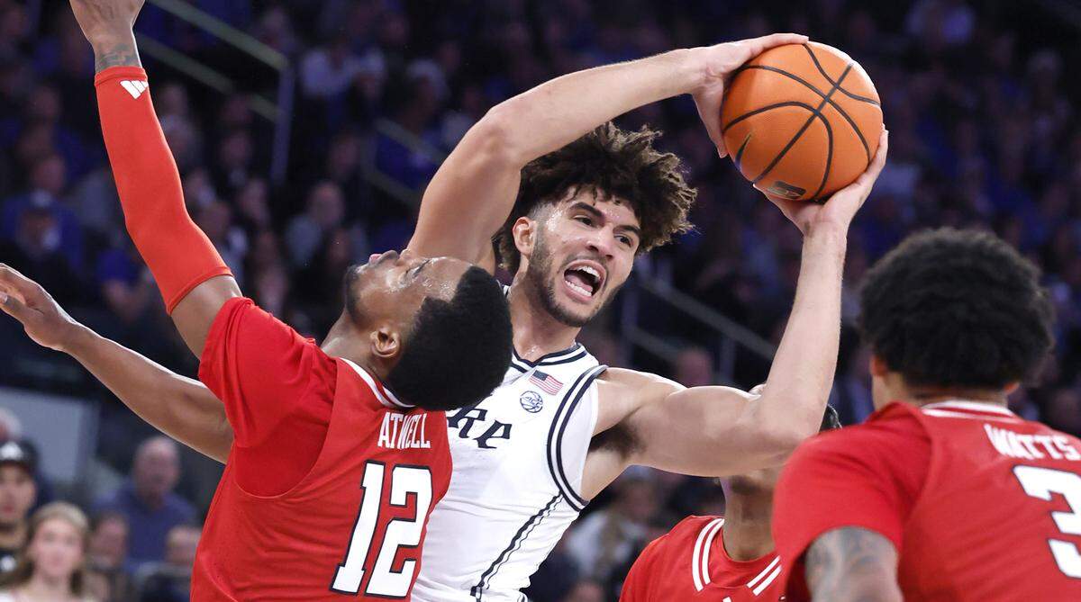 Duke’s Cameron Boozer (12) tries to get around Texas Tech's Donovan Atwell (12) in the first half of DukeÕs game against Texas Tech in the SentinelOne Classic at Madison Square Garden in New York City, N.Y., Saturday, Dec. 20, 2025.