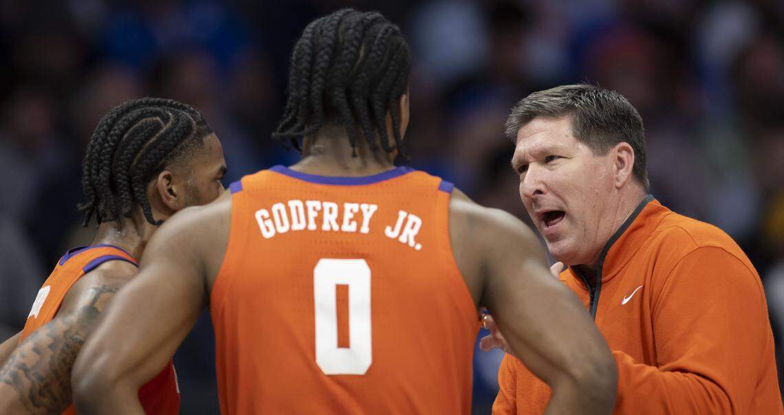 Clemson coach Brad Brownell talks with guard Dillon Hunter (2) and forward R J Godfrey (0) in the first half against Duke on Friday, March 13, 2026, during the semifinals of the ACC Tournament at Spectrum Center in Charlotte, N.C. 