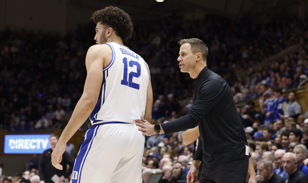 Duke head coach Jon Scheyer talks to Cameron Boozer (12) during the second half of Duke’s 67-54 victory over Clemson at Cameron Indoor Stadium in Durham, N.C., Sat., Feb. 14, 2026.
