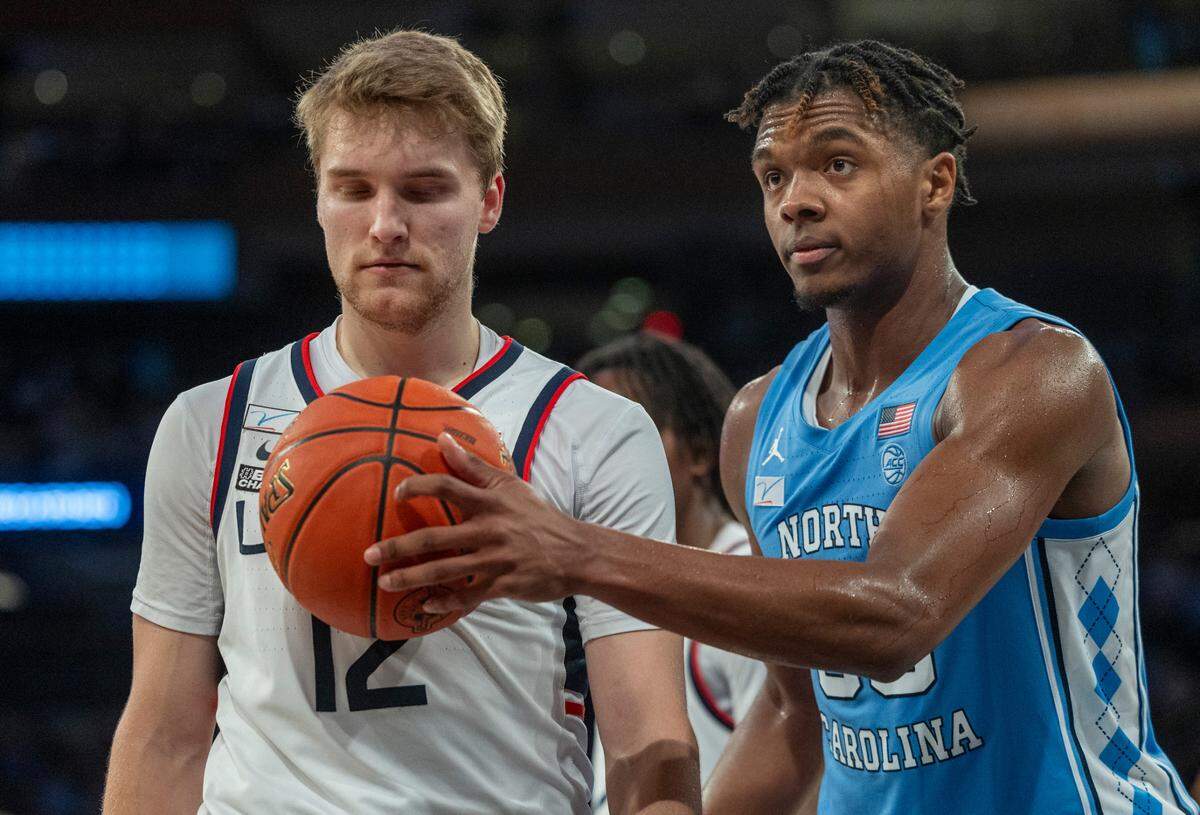 North Carolina’s Harrison Ingram (55) places the ball the chest of Connecticut’s Cam Spencer (12) after a score during the second half in the Jimmy V Classic on Tuesday, December 5, 2023 at Madison Square Garden in New York, NY.