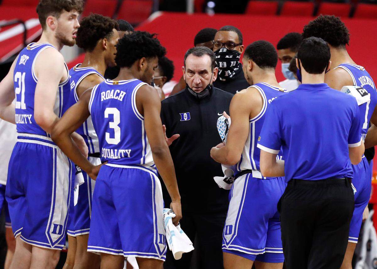 Duke head coach Mike Krzyzewski talks with his team during the first half of N.C. State’s game against Duke at PNC Arena in Raleigh, N.C., Saturday, February 13, 2021.