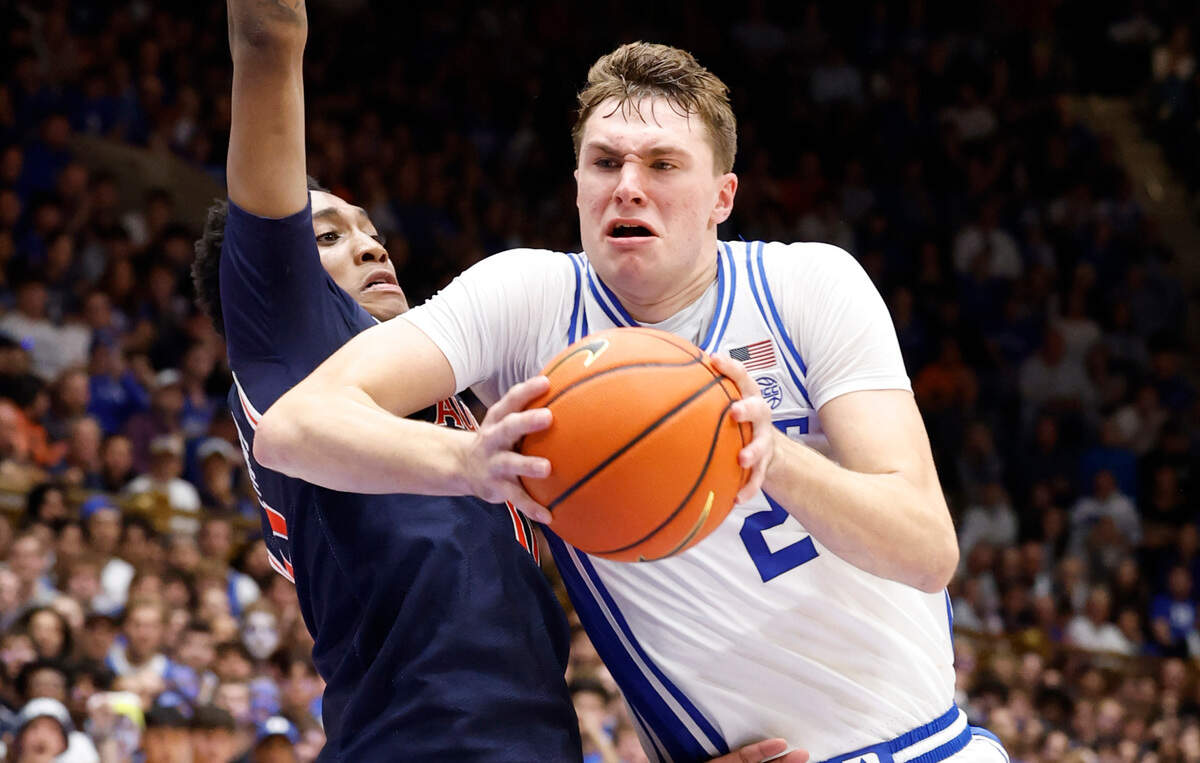 Duke’s Cooper Flagg (2) drives by Auburn’s Tahaad Pettiford (0) during the second half of Duke’s 84-78 victory over Auburn at Cameron Indoor Stadium in Durham, N.C., Wednesday, Dec. 4, 2024.