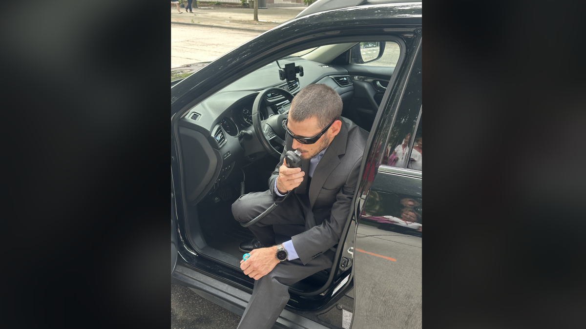 Jason Dedrick demonstrates an ignition interlock device that some drivers convicted of DWI in North Carolina must blow into before starting their cars. A car will not start if the device detects an alcohol concentration of .02 or greater.