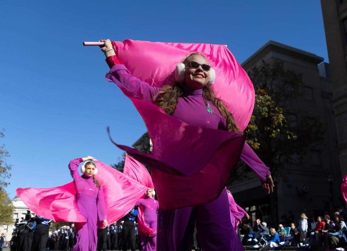 Members of the Midway High School Marching Raiders perform during the Raleigh Christmas Parade on Saturday, Nov. 18, 2023.