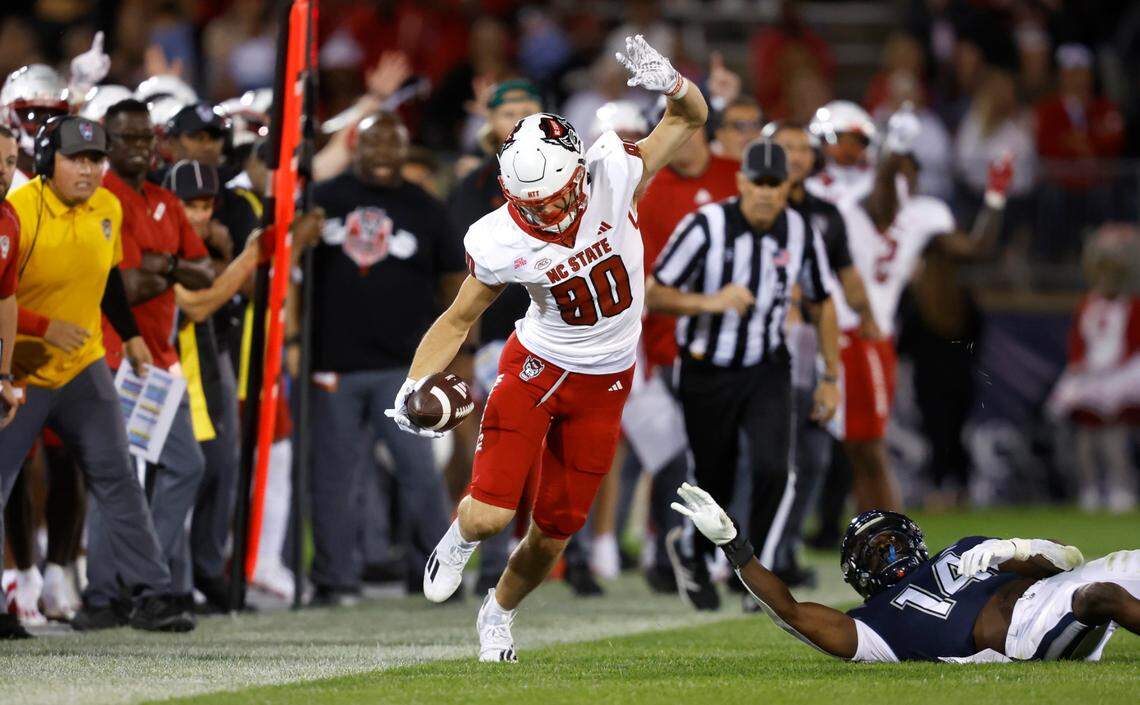 N.C. State wide receiver Bradley Rozner (80) works to stay inbounds after making a reception during the second half of N.C. State’s 24-14 victory over UConn at Rentschler Field in East Hartford, Conn. Thursday, August 31, 2023.
