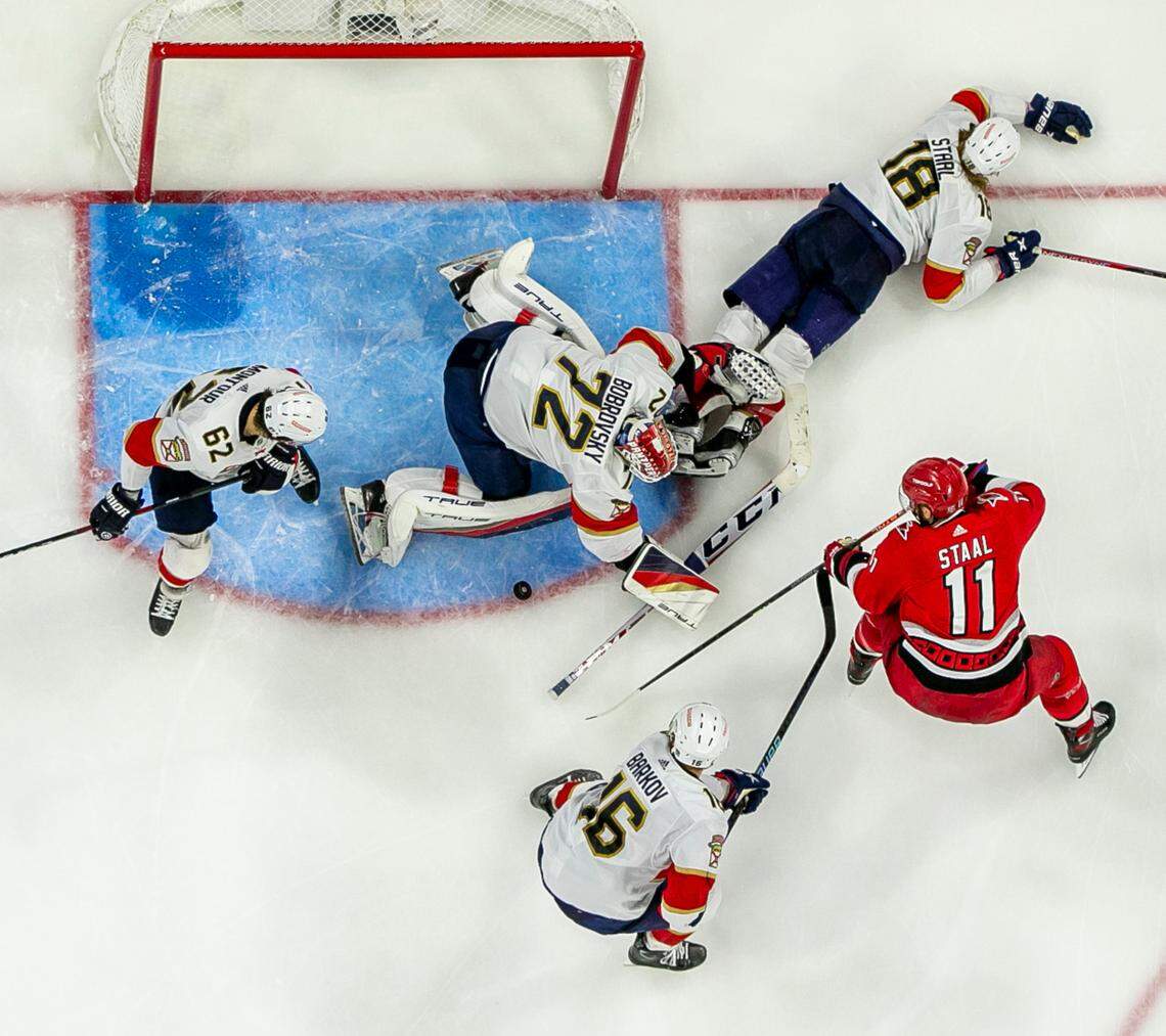 Florida Panthers goalie Sergei Bobrovsky (72) stops a scoring attempt by the Carolina Hurricanes Jordan Staal (11) in overtime during Game 2 of the Eastern Conference Finals on Saturday, May 20, 2023 at PNC Arena in Raleigh, N.C.