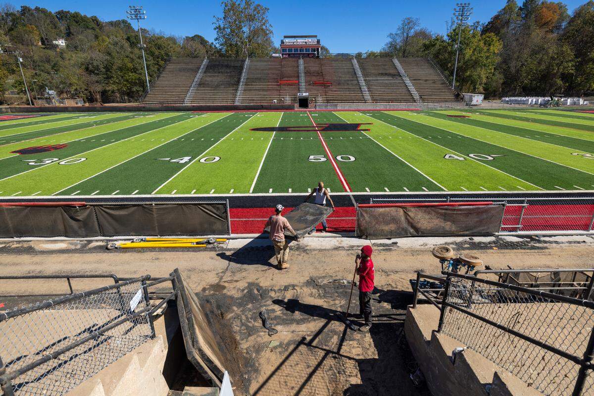 Contractors continue their clean-up of Pisgah Memorial Stadium on Friday, October 18, 2024 in Canton, N.C. The stadium has been closed since historic flooding from Hurricane Helene pushed the Pigeon River into the stadium.