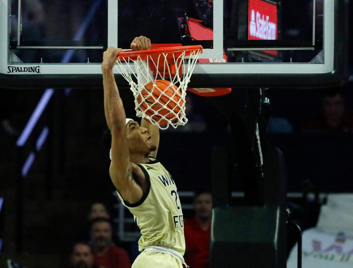 Wake Forest’s Hunter Sallis slams in two during the second half of the Demon Deacons’ 83-79 win over N.C. State on Saturday, Feb. 10, 2024, at Lawrence Joel Veterans Memorial Coliseum in Winston-Salem, N.C.