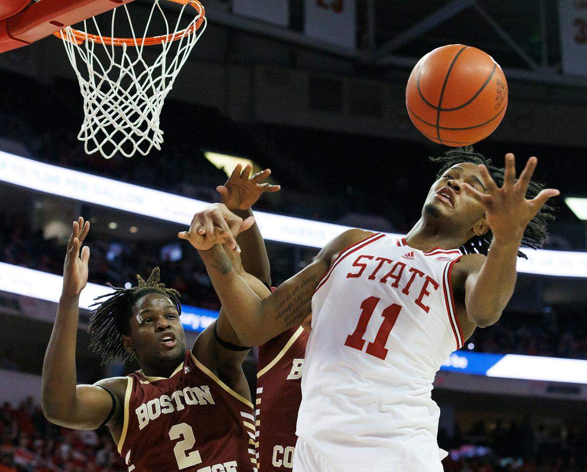 N.C. State’s Dennis Parker Jr. grabs a rebound away from Boston College’s Armani Mighty during the second half of the Wolfpack’s 81-70 win on Saturday, Feb. 24, 2024, at PNC Arena in Raleigh, N.C.