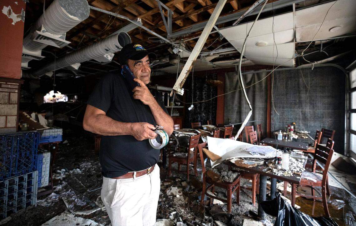 Jamil Kadoura, owner of Mediterranean Deli, Bakery and Catering, stands inside the Chapel Hill restaurant on Monday, July 24, 2023, following a Saturday fire in which the building suffered extensive damage.