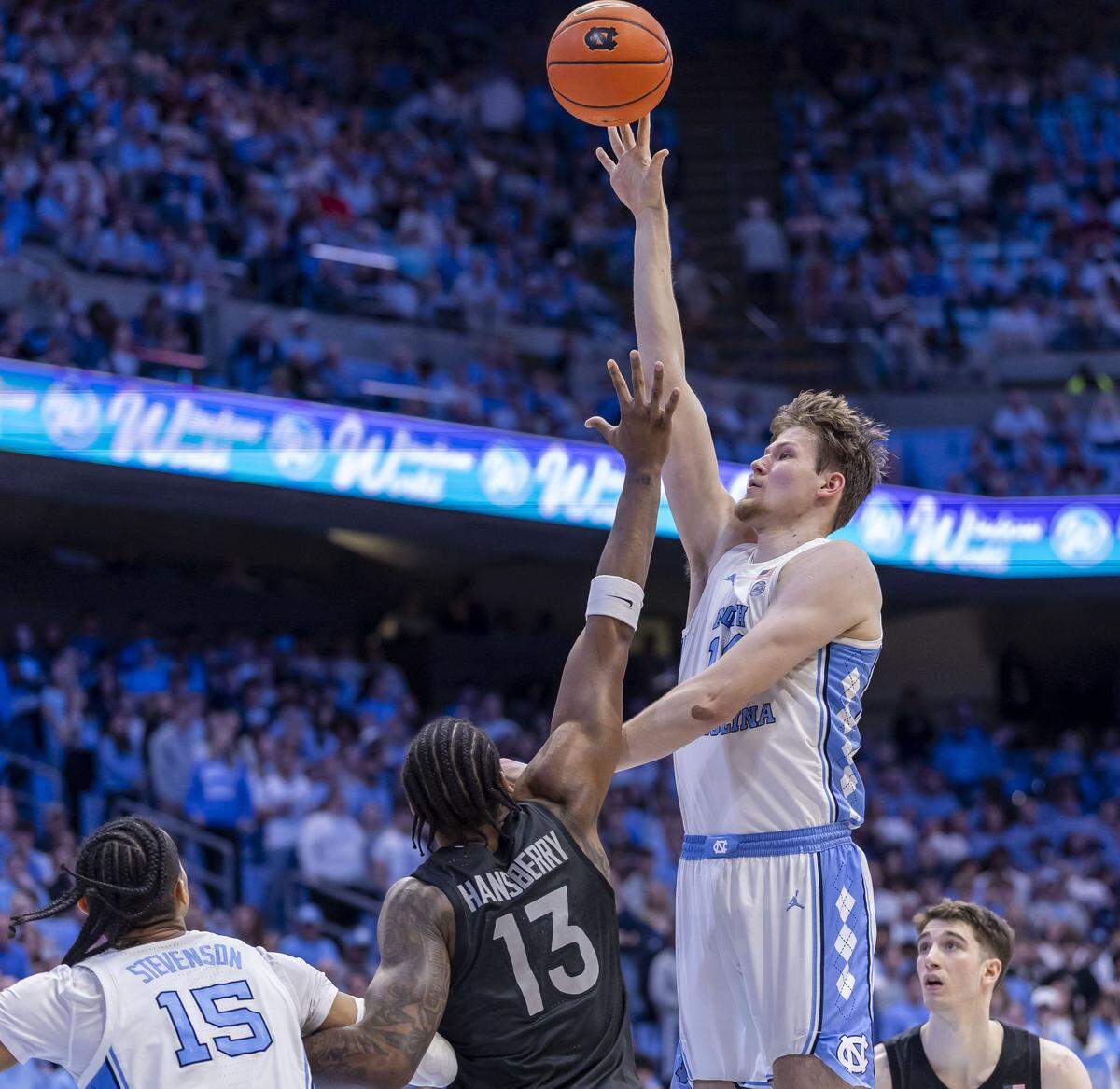 North Carolina center Henri Veesaar (13) puts up a shot against Virginia Tech forward Amani Hansberry (13) in the second half on Saturday, February 28, 2026 at the Smith Center in Chapel Hill, N.C. 