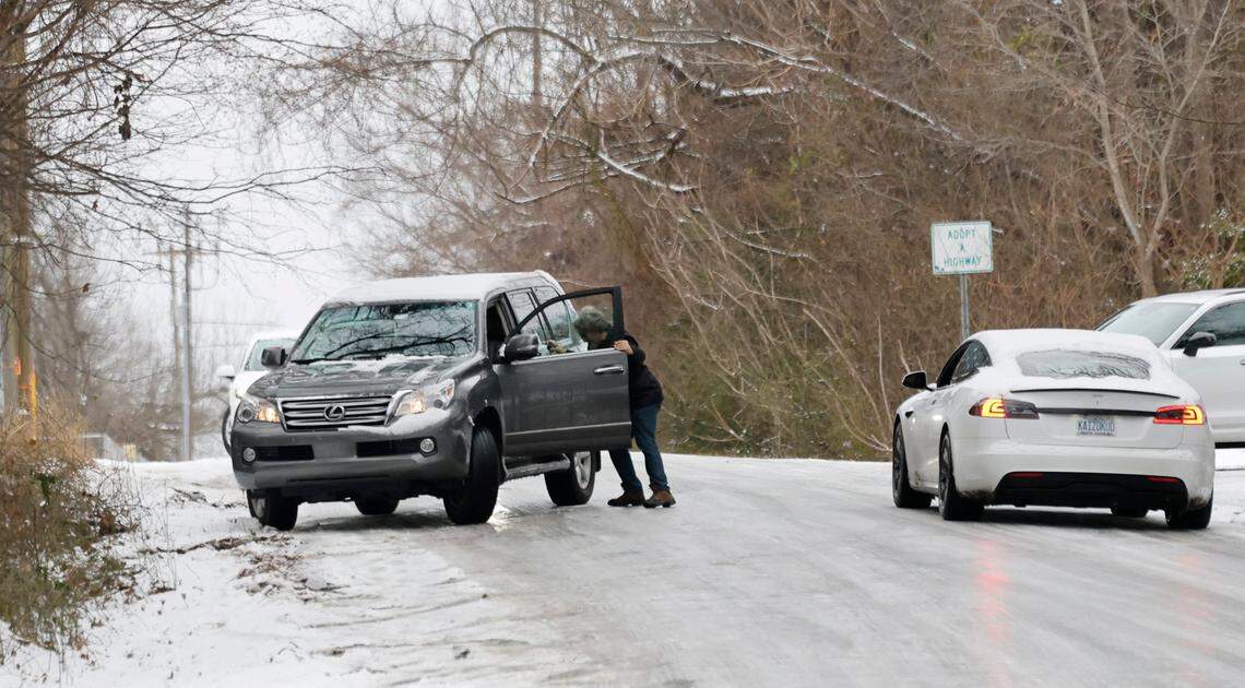 People navigate an icy Lake Wheeler Road by S. Saunders Street in Raleigh Thursday morning, Feb. 20, 2025.