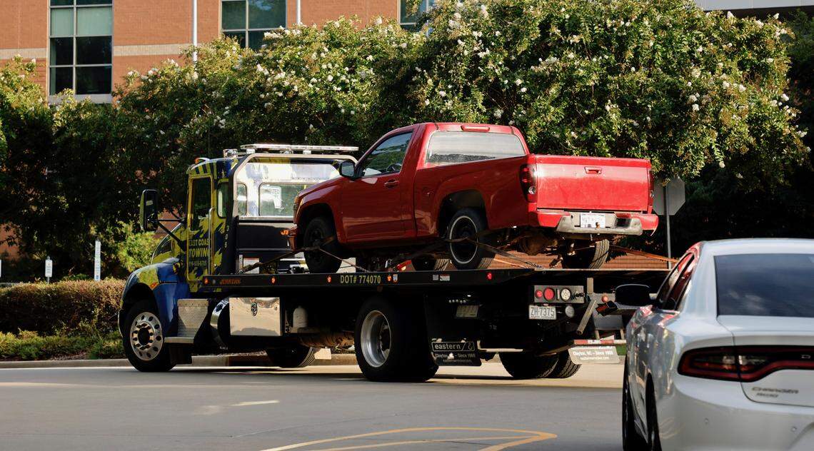 A red pickup truck is transported to the Wake County Detention Center/City-County Bureau of Identification in Raleigh, N.C., Wednesday, August 17, 2022.