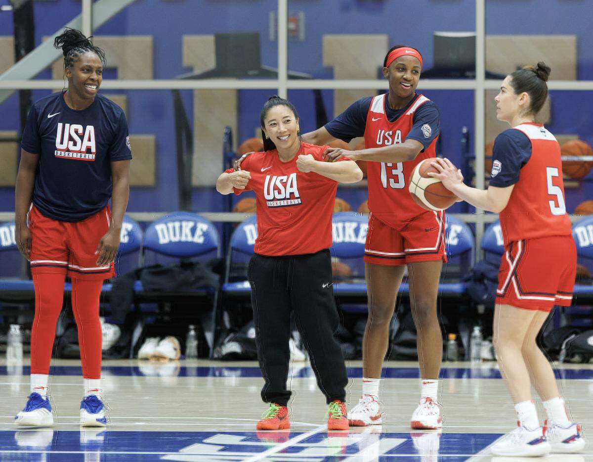 Jackie Young (13) shares a laugh with Golden State Valkyries head coach Natalie Nakase during USA Basketball Women’s National Team training camp on Friday, Dec. 12, 2025, in Durham, N.C.