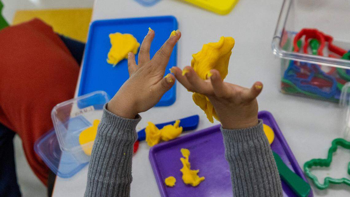 Pre-schoolers play with Play-Doh at the Early Learning Center at Memory Road, Thursday, Nov. 30, 2023. The Center is Wake County’s first standalone Pre-K center with space for up to 132 students.