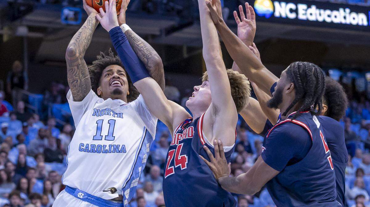 North Carolina guard Jonathan Powell (11) puts up a shot against Radford guard Lukas Walls (24) in the first half on Tuesday, November 11, 2025 at the Smith Center in Chapel Hill, N.C.