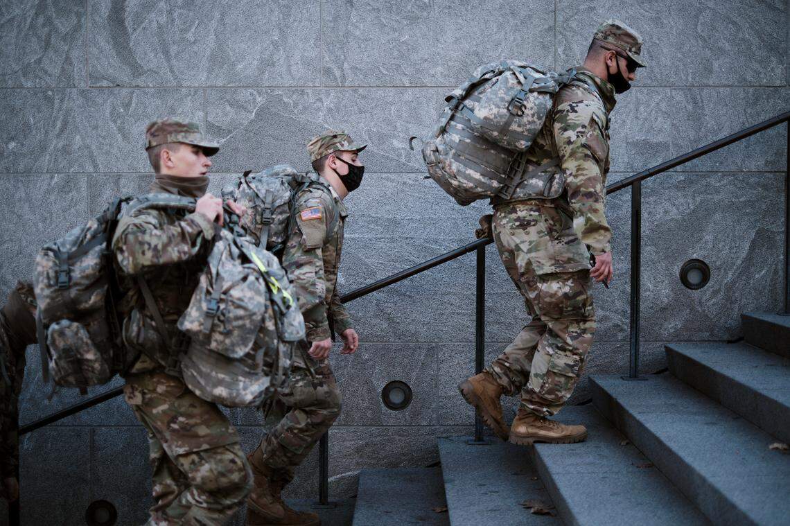 National Guard troops at the Capitol complex in Washington on Wednesday afternoon, Jan. 13, 2021. The House undertook an emotionally charged debate on Wednesday over impeaching President Donald Trump, as lawmakers marched toward an afternoon vote to charge him just one week after he incited a mob of loyalists to storm the Capitol and stop Congress from affirming President-elect Joe BidenÕs victory in the November election.