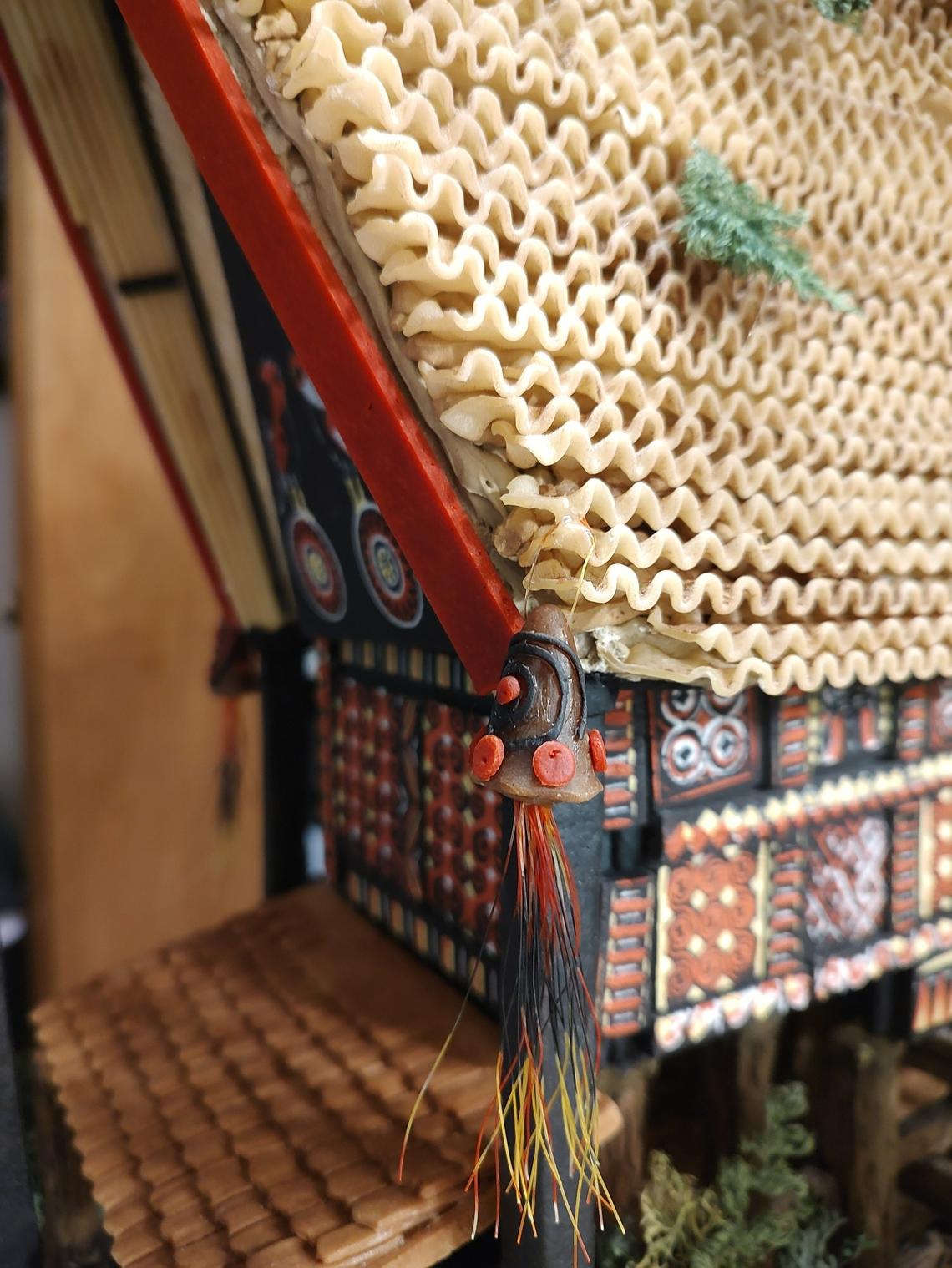 The tassles on Faith An and Deborah Kinton’s “Christmas at the Tongkonan” gingerbread house were made of catgut dental suchers, a technically edible ingredient that An got permission to use back in February 2023.