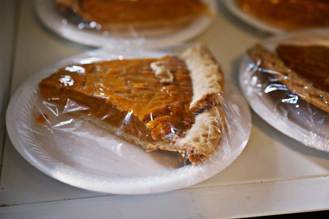 Sweet potato pie slices are readied in a cooler for customers to pick up at Grady’s Barbecue in Dudley, NC, Friday morning, Oct. 30, 2020.