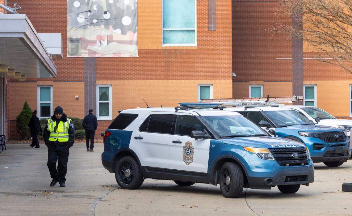 Raleigh Police vehicles are parked outside Southeast Raleigh High School after the school reopened, days after Delvin Ferrell’s death.