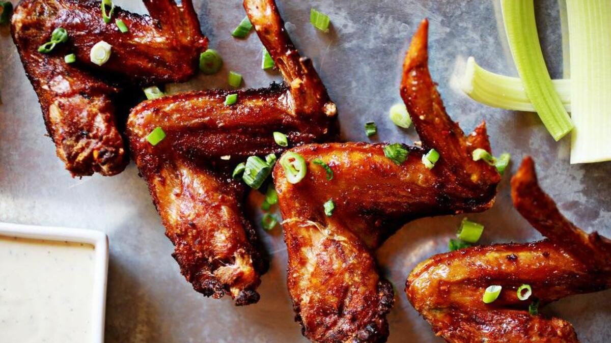 If you don’t get wings from a restaurant, like these smoked wings from Durham’s It’s a Southern Thing, here’s a recipe to make them at home.