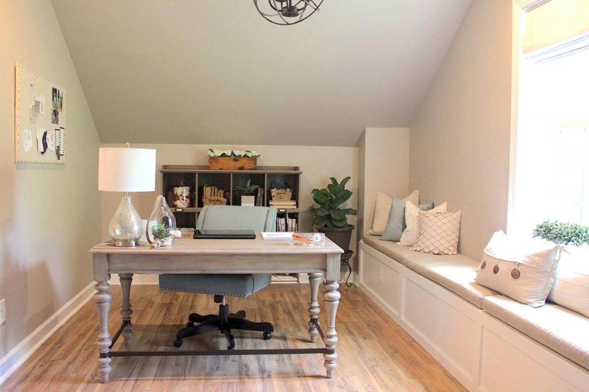 This attic was renovated into a home office in Wake Forest. There are a few built-ins that are always a good idea. Built-in shelving works wonders in living areas and bonus rooms. Built-in seating by the front door or in the “drop zone” is always functional.