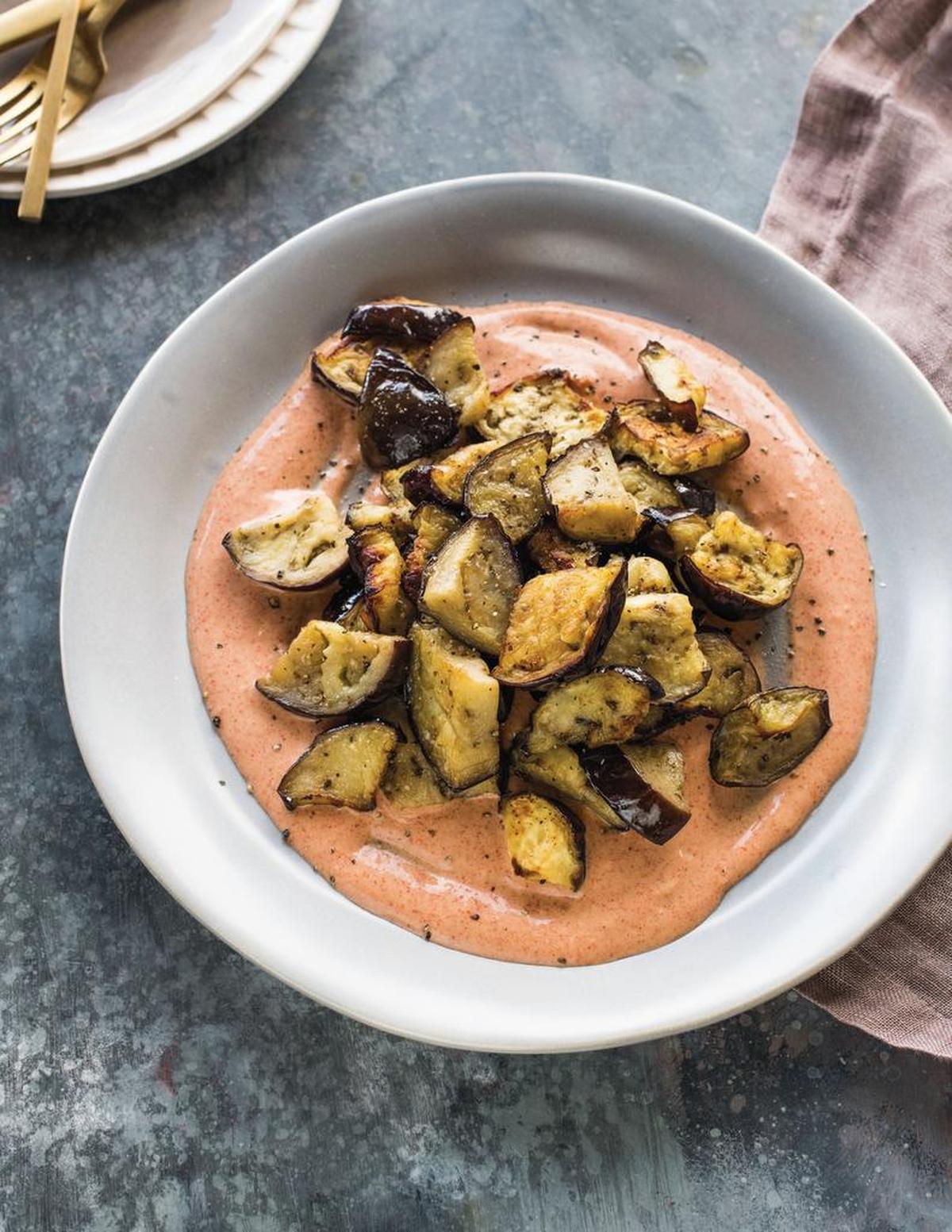 Caramelized Eggplant with Harissa Yogurt from “Air Fry Every Day” by Ben Mims. He recommends making Caramelized Eggplant with Harissa Yogurt to win over those who think they don’t like eggplant.