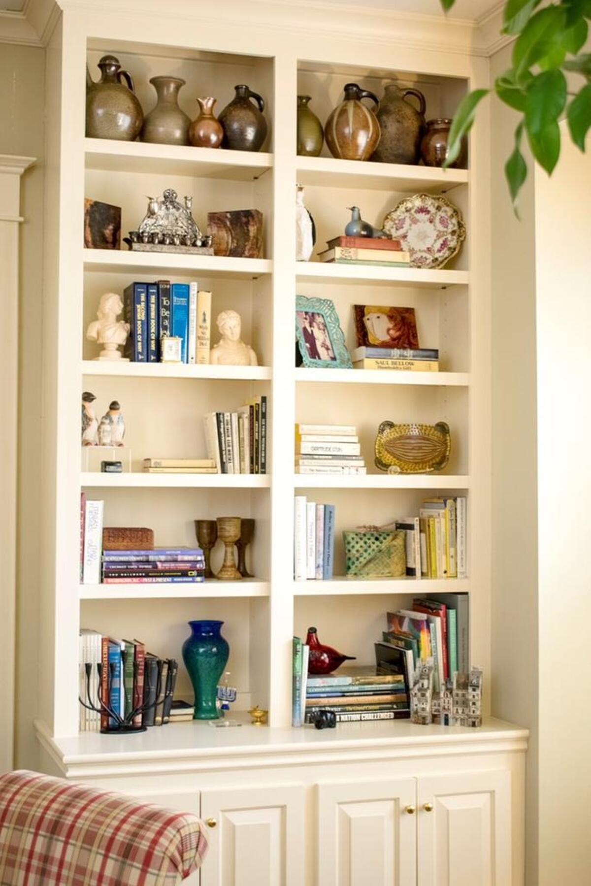 North Carolina pottery is nestled high above the books in these custom built-ins.