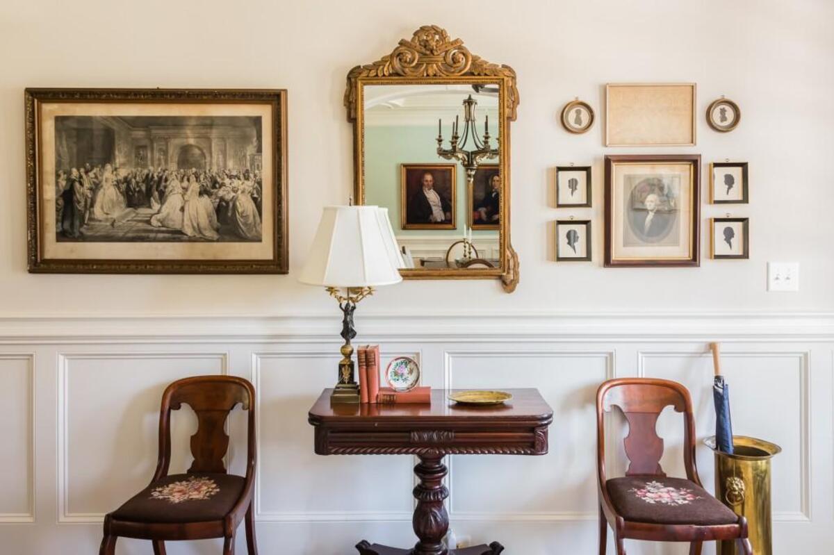 An art collection on either side of a mirror illustrates a different kind of symmetry.